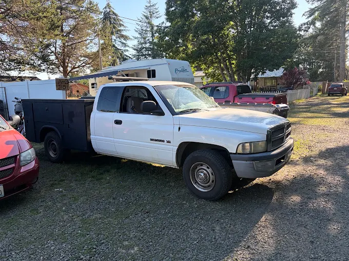 Moose and Goose Roadside Service truck parked in the yard